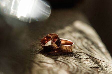 Gold wedding rings. The concept of marriage, family relationships, wedding paraphernaliaの写真素材
