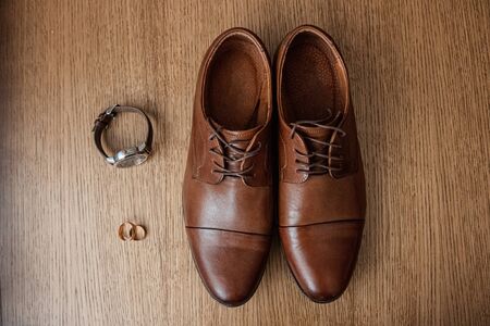 Wedding accessories, shoes, watches, rings, bow tie. The concept of marriage, family relationships wedding paraphernaliaの写真素材