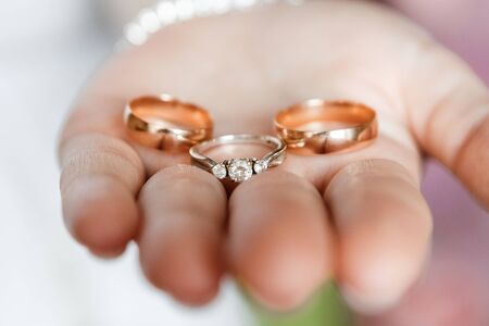 Wedding rings.Wedding rings in hands. The concept of marriage, family relationships, wedding paraphernaliaの写真素材