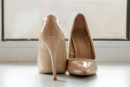 composition - wedding shoes with decor and accessories. The concept of marriage, family relationships, wedding paraphernaliaの写真素材