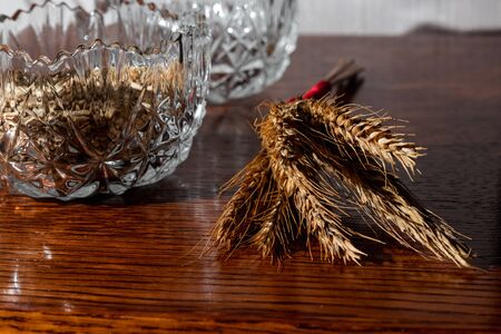 composition of a vase with seeds, twigs twisted on the tableの写真素材
