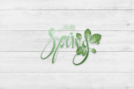 Handwritten inscription hello spring. Spring floral natural background. Copy spaceの写真素材