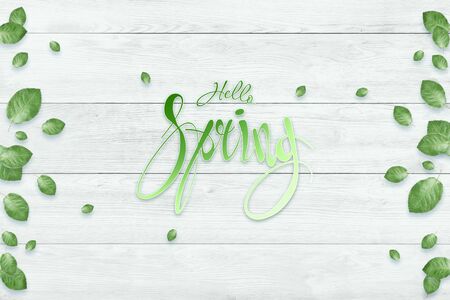Handwritten inscription hello spring. Spring floral natural background. Copy spaceの写真素材