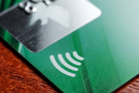 Contactless credit card sign close-up, soft focus. New technologies, EMV chip card, smart payment cardsの写真素材