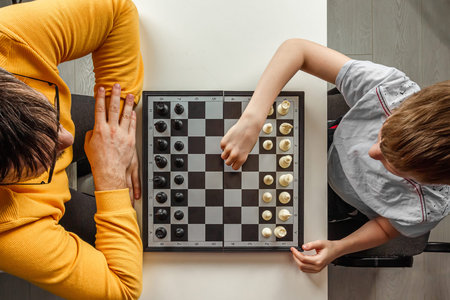 Boy with father. Play chess, family relationships, family flat lay