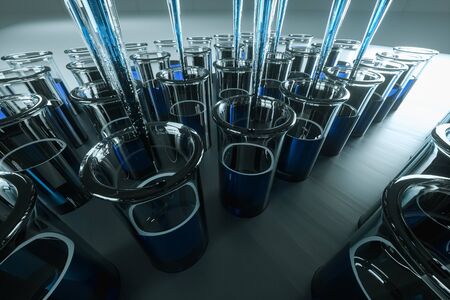 Scientific laboratory test tubes with blue liquid and laboratory test pipettes. The concept of...