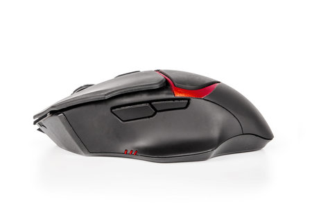 Black gaming computer mouse isolated on a white background. Technology concept, future
