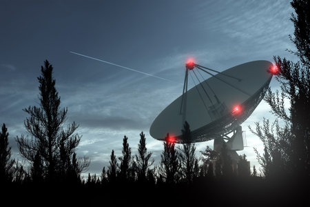 Radio telescope, a large satellite dish against the night sky tracks the stars. Technology concept,...
