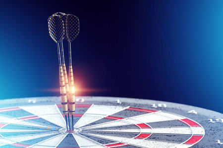 Darts, a golden dart stuck in a target. Dartboard is the target and goal. Business getting into the...