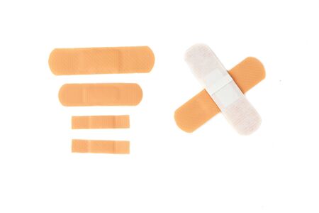 Adhesive plaster isolated on white background. Healing wounds, scratches, sadinの写真素材