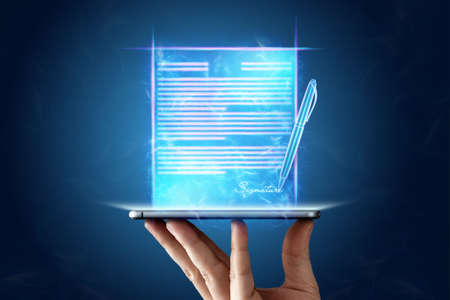 Concept for electronic signature, distance business, mobile phone and contract hologram image for signature. remote collaboration, copy space. Mixed mediaの写真素材