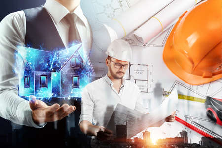 Male architect, builder, handyman on the background of blueprints and construction sites. The concept of construction, architecture, design, business. Mixed environment, double exposureの写真素材