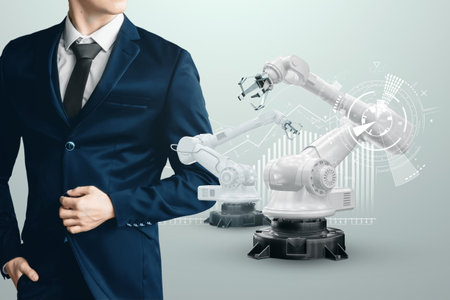 Image of a male businessman in a suit and robotic arms. Iot technology concept, smart factory. Digital manufacturing operation. Industry 4.0.の写真素材
