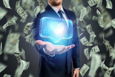 The hand of a businessman holds a hologram of a heart on the background of falling one hundred...