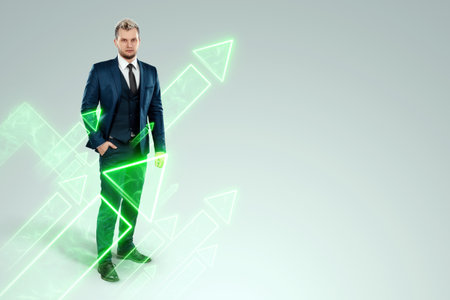 A businessman in a business suit looking for an opportunity against the background of green arrows pointing up. Development concept, start-up, investment search. Copy spaceの写真素材