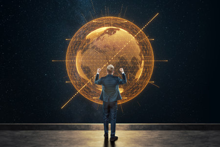 A man in a business suit, a businessman stands against the background of the globe. Mixed media. Concept Global networks and international business.の写真素材
