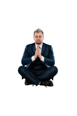 A man in a business suit, a businessman in the lotus position. Isolated on a white backgroundの写真素材