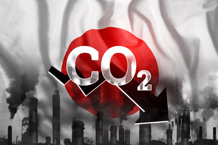 CO2 emissions into the atmosphere. Pipes with black smoke against the background of the Japan flag....