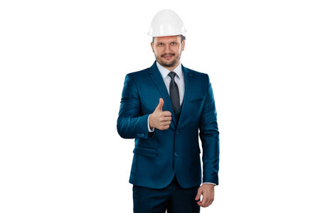 A man in a business suit, an architect with a white helmet on his head, isolated on a white...