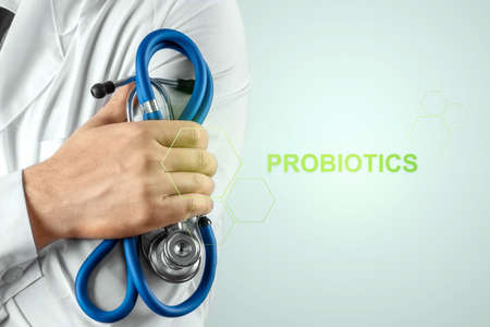 Doctor close-up and inscription probiotics. The concept of diet, intestinal microflora, microorganisms, healthy digestionの写真素材