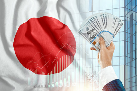 Money in a man's hand against the background of the flag of Japan. Japanese income. The financial...
