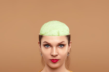 There is cabbage in the head of a beautiful girl. The concept of useful food for the brain, healthy...