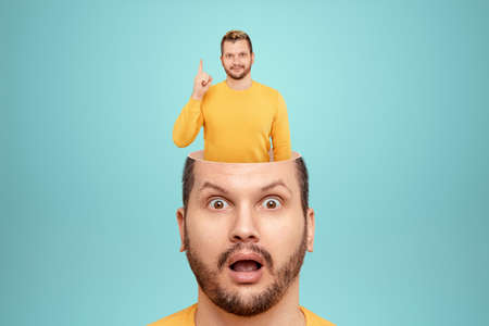 In the man's head, the brain came up with an idea. The concept is a fresh look, a new idea, a creative solution, out-of-the-box thinkingの写真素材