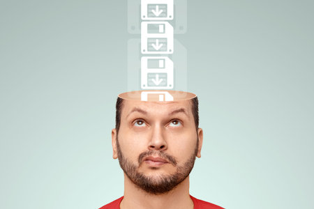 Save cards fall into the man's open head. The concept of memory work, memorization process, brain...