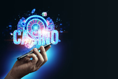 In a man's hand a smartphone with neon playing cards, roulette and chips, the inscription casino. Concept for online games, online casino, gambling, bets. 3D illustration, 3D rendering.の写真素材