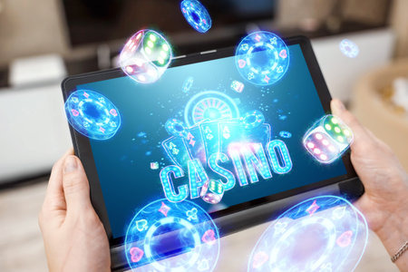 A tablet in female hands and neon casino reboot, roulette, dice, chips. Online casino, gambling, internet games, betting. Website header, flyer, poster, template for advertisingの写真素材