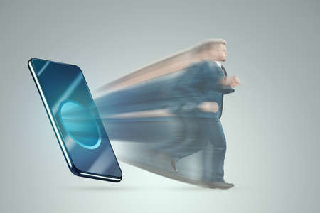 The smartphone sucks in the figure of a man. The concept of smartphone addiction, modern problems, life on the Internet, social. networksの写真素材