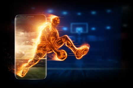 The fiery image of a basketball player cuts out of his smartphone. Creative collage, sports app....