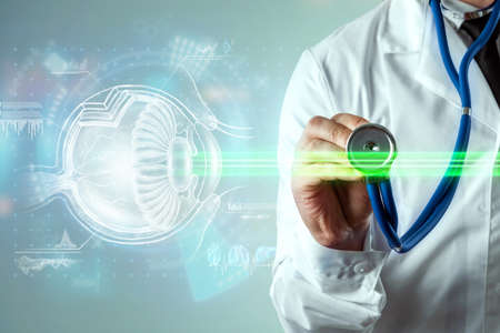 Laser eye surgery, human eye hologram and laser beam, the doctor performs the operation. The concept of eye surgery, catheract, ostegmatism, modern ophthalmologistの写真素材