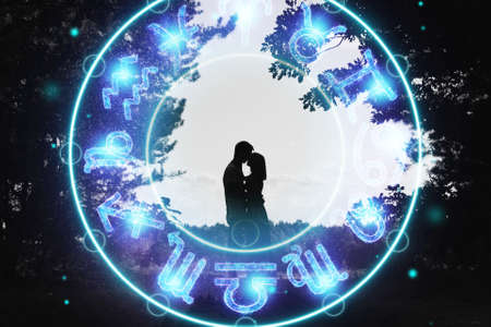 Horoscope concept, couple guy and girl on the background of a circle with the signs of the zodiac, astrology. Conceptual photo of a couple with perfect match between the signs of the zodiacの写真素材