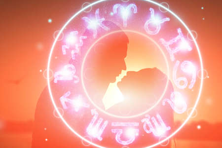 Horoscope concept, couple guy and girl on the background of a circle with the signs of the zodiac, astrology. Conceptual photo of a couple with perfect match between the signs of the zodiacの写真素材