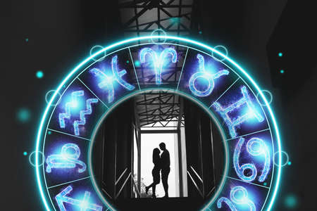 Horoscope concept, couple guy and girl on the background of a circle with the signs of the zodiac, astrology. Conceptual photo of a couple with perfect match between the signs of the zodiacの写真素材