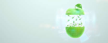 Food supplement in the form of medicinal capsules inside a green apple. Alternative medicine, vitamins, naturopathy, health, homeopathy. 3D illustration, 3D renderの写真素材