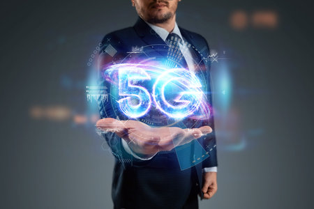 Over hand of businessman 5G hologram, creative background. 5G network concept, high speed mobile...