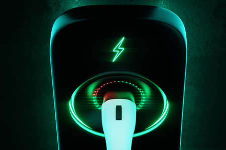 Charging station for an electric car on a dark background. Power station, neon, green technology, future, copy space. 3D rendering, 3D illustration.の写真素材