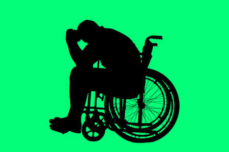 Silhouette of a disabled man in a wheelchair. The concept of disability and illness, depression, fatigue, fear, apathyの写真素材