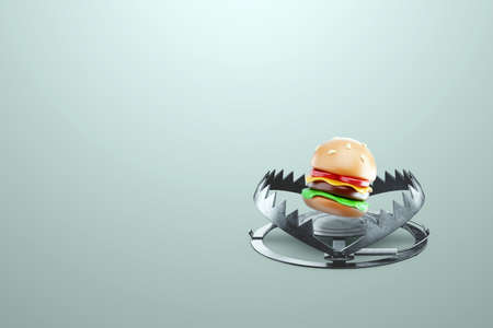 Burger in a large metal bear trap, close-up. The concept of gluttony, obesity, fast food, addiction, malnutrition. 3D rendering, 3D illustrationの写真素材