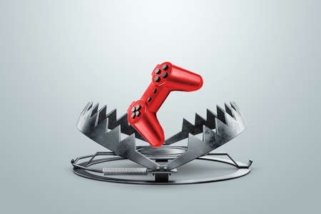 game addiction, Gamepad in a metal bear trap, close-up. The concept of addiction, child, illness. 3D rendering, 3D illustration.の写真素材