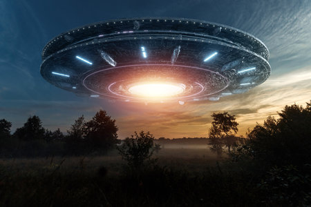 UFO, an alien saucer hovering above the field in the clouds, hovering motionless in the sky. Unidentified flying object, alien invasion, extraterrestrial life, space travel, spaceship. mixed mediaの写真素材