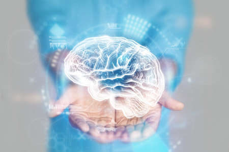 Medical concept, doctor's hands in a blue coat close-up. Brain ultrasound, MRI, x-ray, hologram. Medical care, anatomy, doctor's appointment, study of nerons. mixed mediaの写真素材