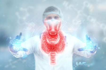 Thyroid gland, Doctor looks at a hologram or ultrasound of the patient's thyroid gland. Ultrasound diagnostics, thyroid diseases, medical indicatorsの写真素材