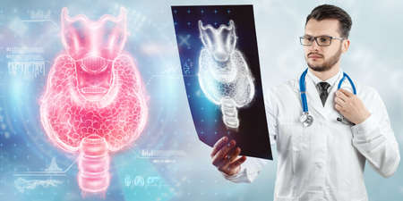 Thyroid gland, Doctor looks at a hologram or ultrasound of the patient's thyroid gland. Ultrasound diagnostics, thyroid diseases, medical indicatorsの写真素材