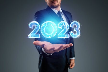 Happy new year, businessman points to the number 2023. Magazine style, banner, website header, web posterの写真素材