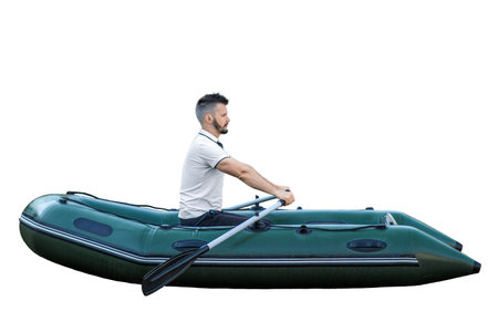 A man in an inflatable boat with oars on a white background.の写真素材