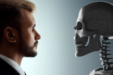 Close-up portrait of a man looking at a human skull, facing death. Concept of death, old age, problems, aging, disease, otherworldly. Copy space, 3D rendering, 3D illustrationの写真素材