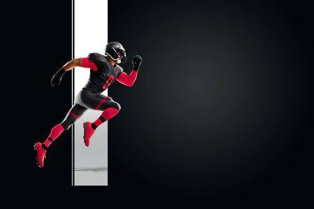 American Football player in red and black uniform in running pose on black background. American Football, advertising poster, template, blank, sports. 3D illustration, 3D renderingの写真素材